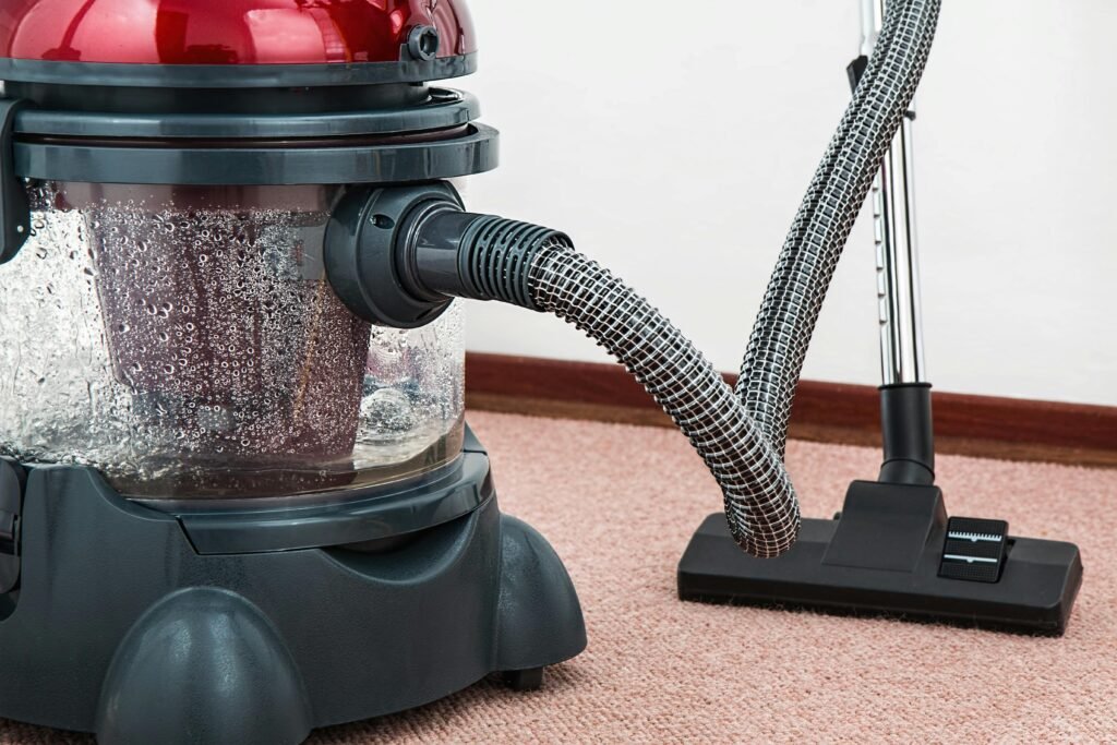 vacuum-cleaner-carpet-cleaner-housework-housekeeping-38325-38325 Black and Red Canister Vacuum Cleaner on Floor